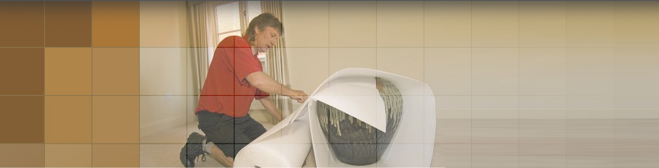Secure Storage Service in Leicester Man bubble wrapping up a large vase